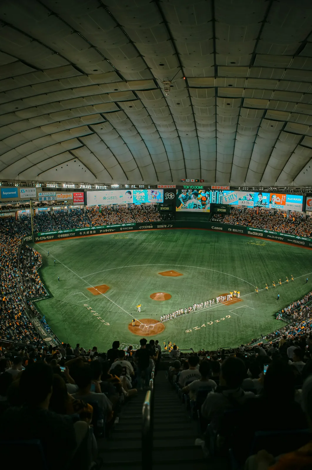 A baseball stadium filled with lots of people