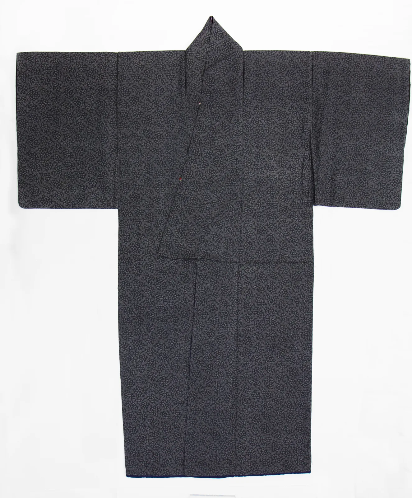 An Edo-period robe dyed with a fine all-over komon pattern