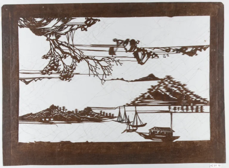 A carved paper dye stencil with a seascape of boats and shore pines