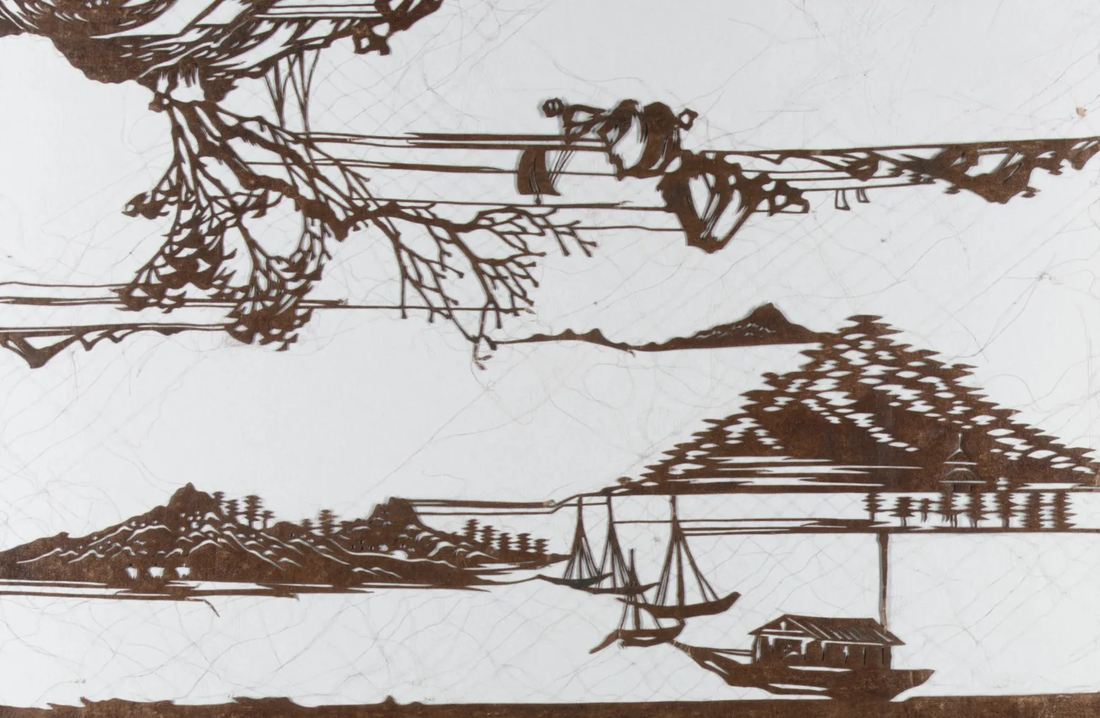 Detail of an Edo-period paper dye stencil with boats and shore pines