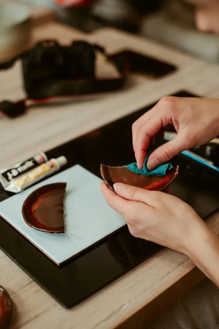 Repairing a broken ceramic bowl with glue and a cloth