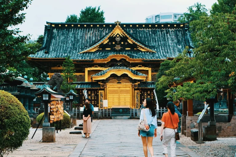 people near gold and blue temple during daytime