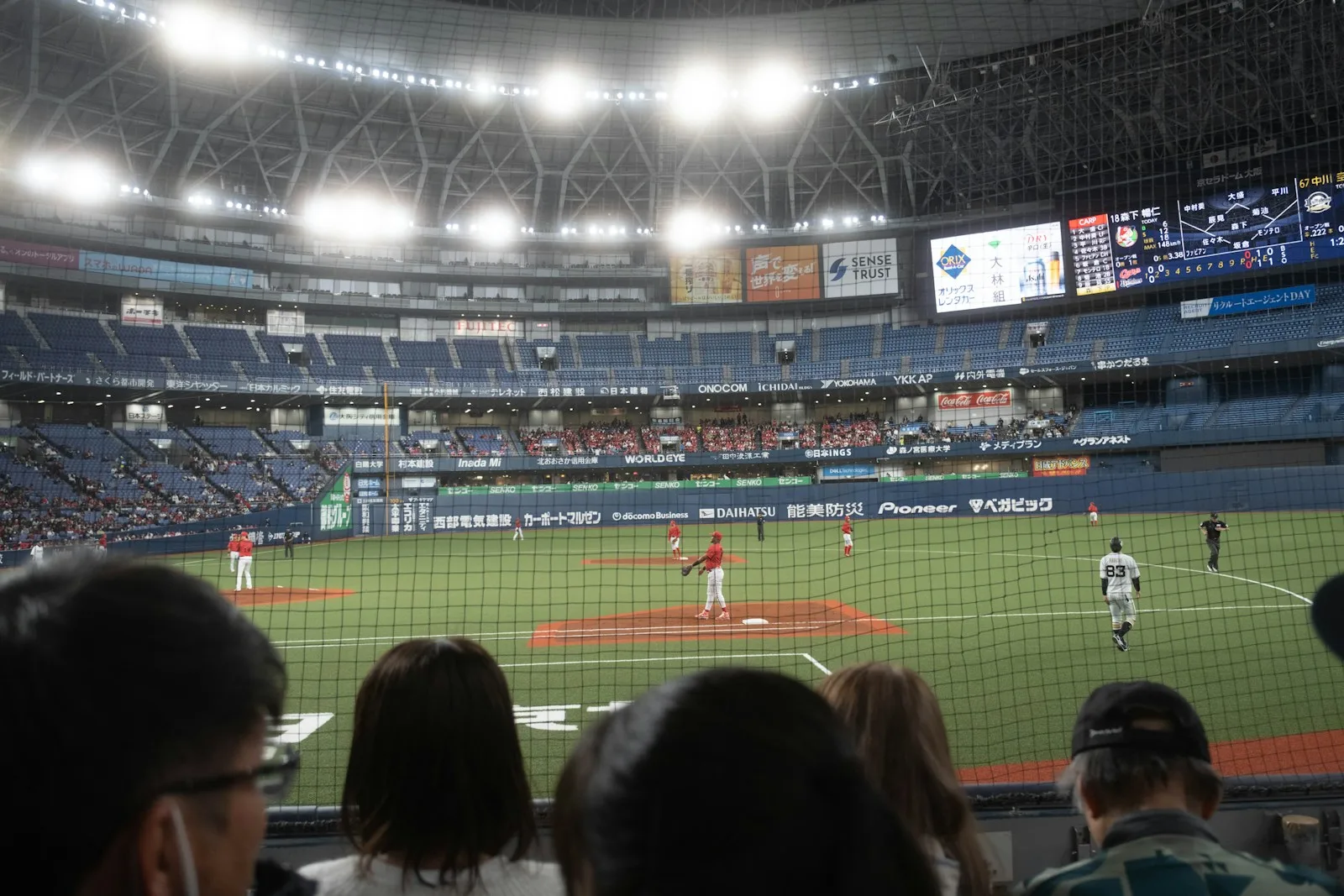 Baseball game in a stadium with spectators watching
