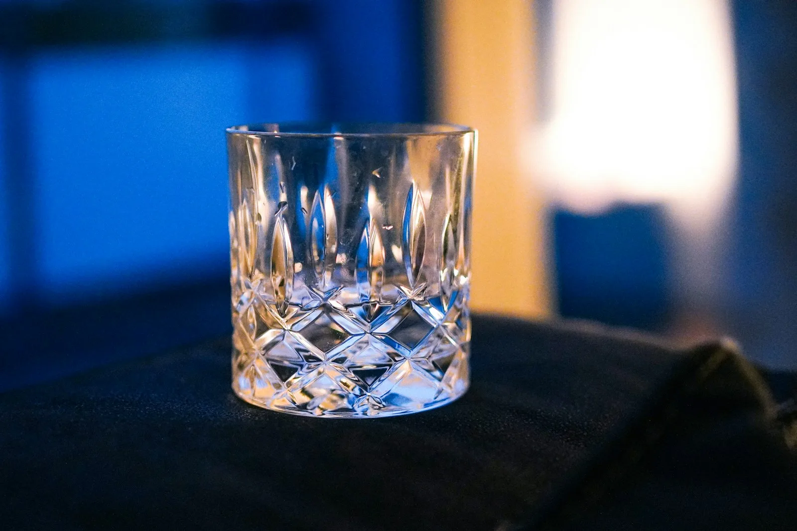 A clear glass sitting on top of a table