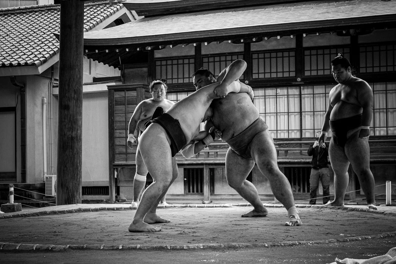 A couple of people that are standing in the street
