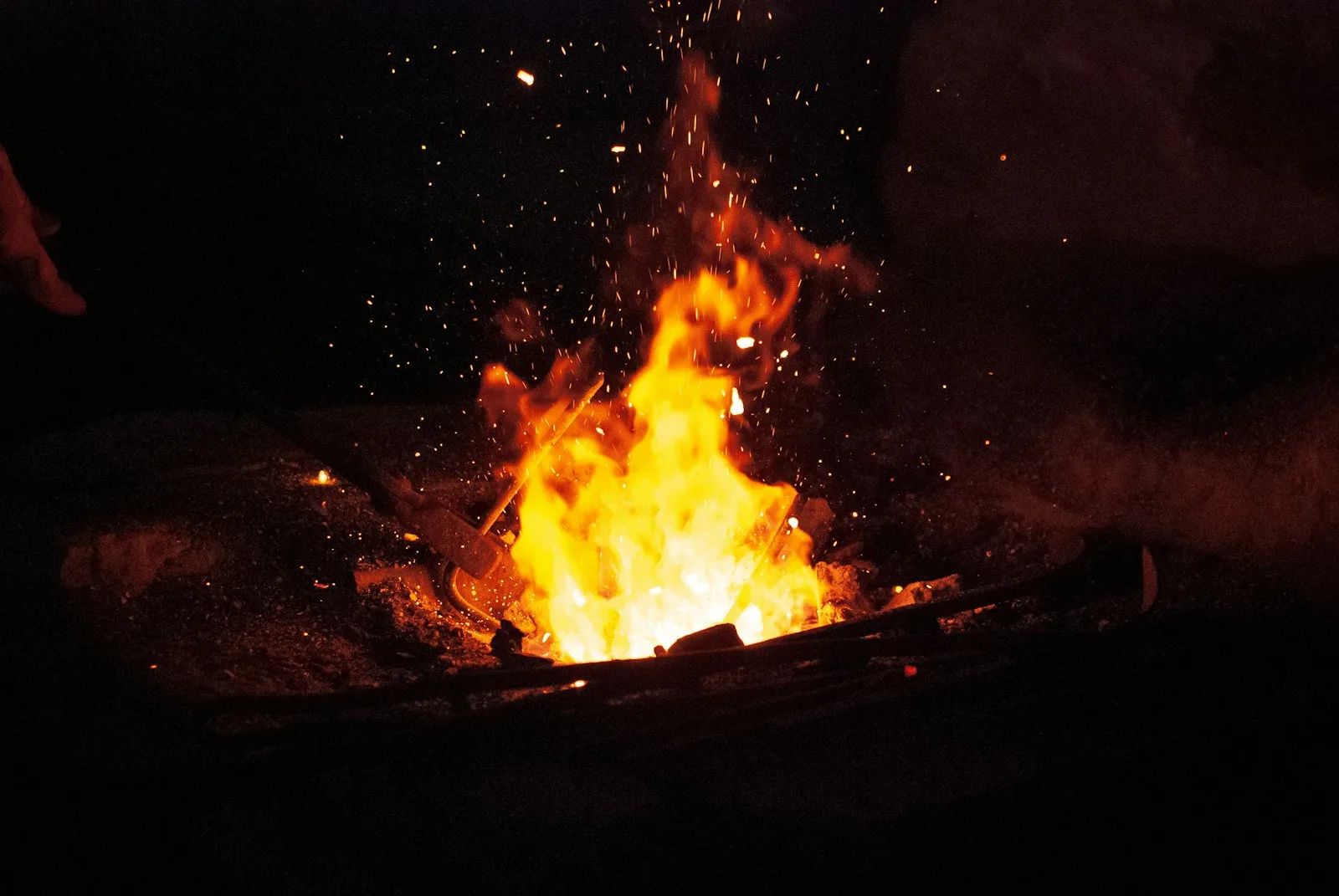 Flames and sparks at a swordsmith's forge in Japan